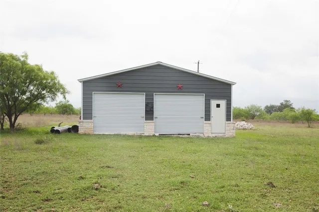 a view of a tree in front of a house