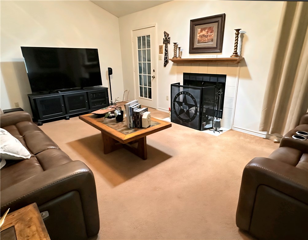 219 Ripple Creek Lane Somerville, TX 77879 - Photo 22 of 46 a living room with furniture and a flat screen tv