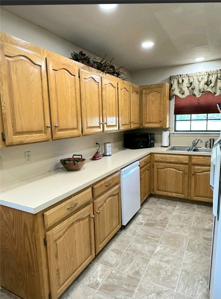 219 Ripple Creek Lane Somerville, TX 77879 - Photo 25 of 46 a kitchen with a sink cabinets and window