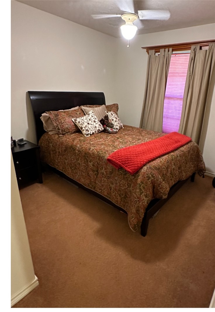 219 Ripple Creek Lane Somerville, TX 77879 - Photo 33 of 46 a bedroom with a bed and window