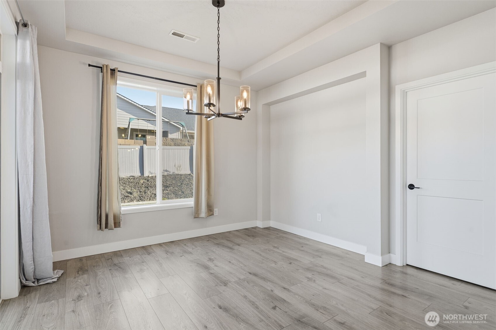 2572 Clark Ridge Drive Richland, WA 99352 - Photo 12 of 25 a view of empty room with wooden floor fan and window