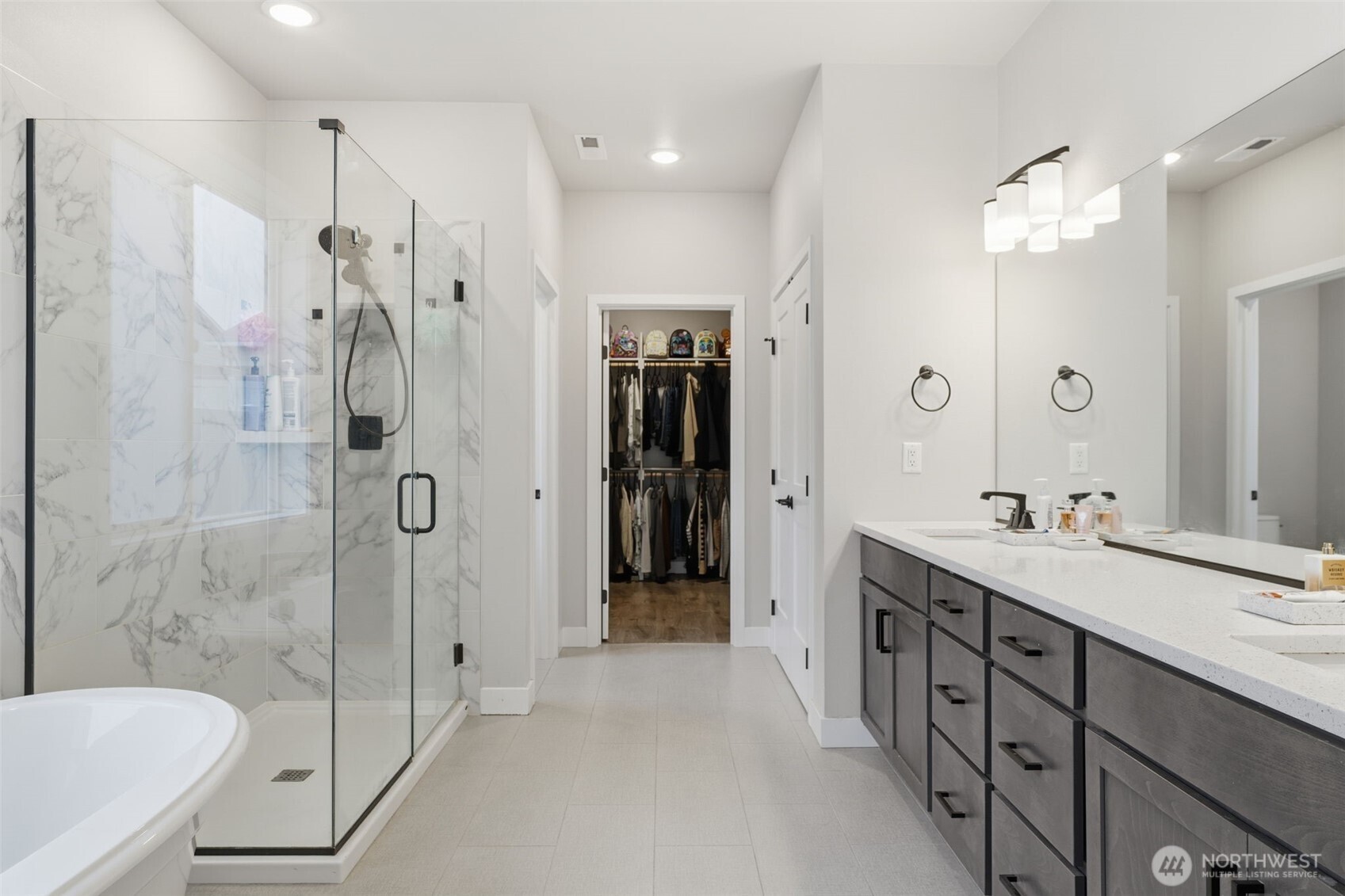 2572 Clark Ridge Drive Richland, WA 99352 - Photo 12 of 18 a bathroom with a double vanity sink mirror and shower