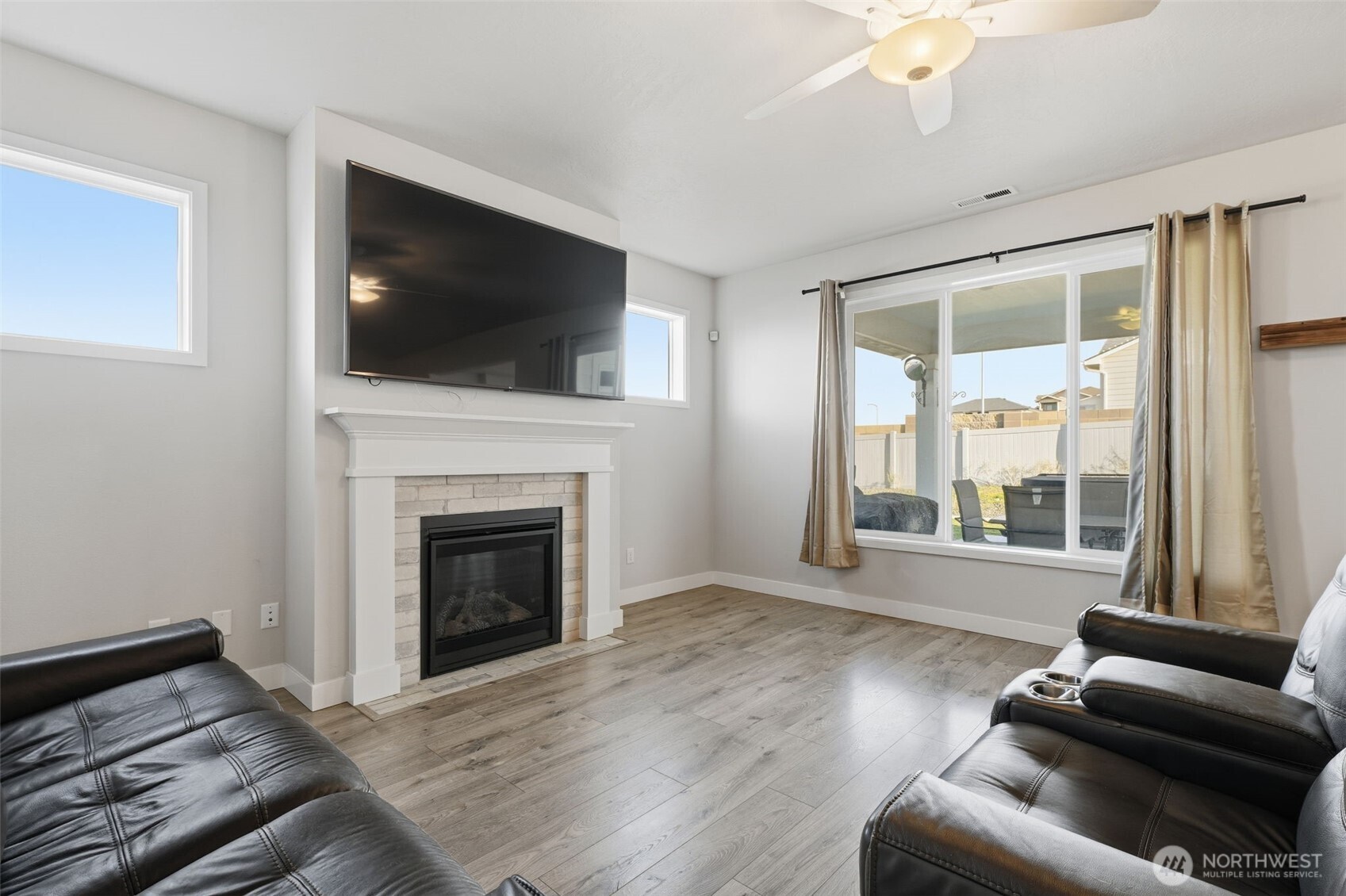 2572 Clark Ridge Drive Richland, WA 99352 - Photo 6 of 25 a living room with furniture fireplace and flat screen tv