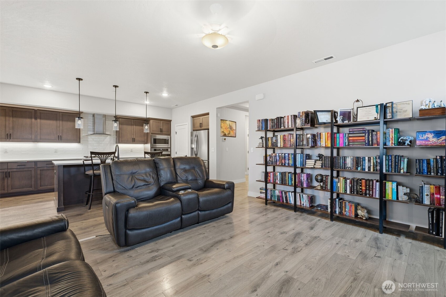 2572 Clark Ridge Drive Richland, WA 99352 - Photo 7 of 18 a living room with furniture and a book shelf