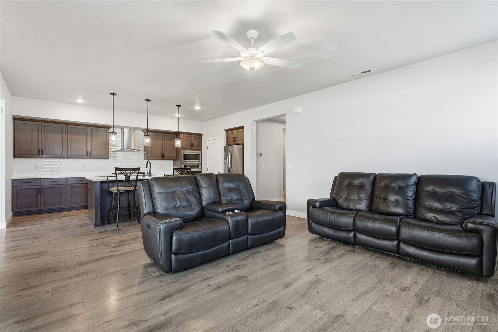 2572 Clark Ridge Drive Richland, WA 99352 - Photo 7 of 25 a living room with furniture kitchen and a wooden floor