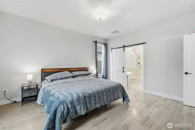 a view of walk in closet with clothes