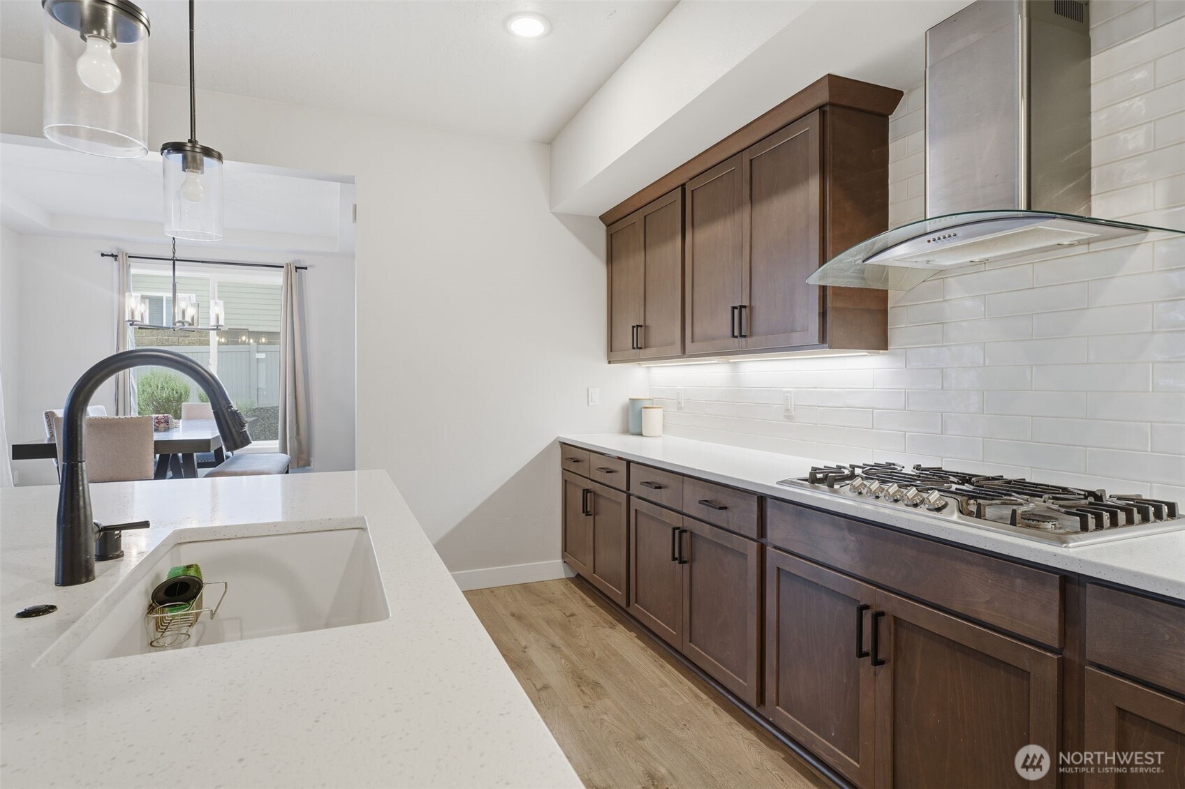 2572 Clark Ridge Drive Richland, WA 99352 - Photo 10 of 25 a kitchen with stainless steel appliances granite countertop a sink stove and cabinets