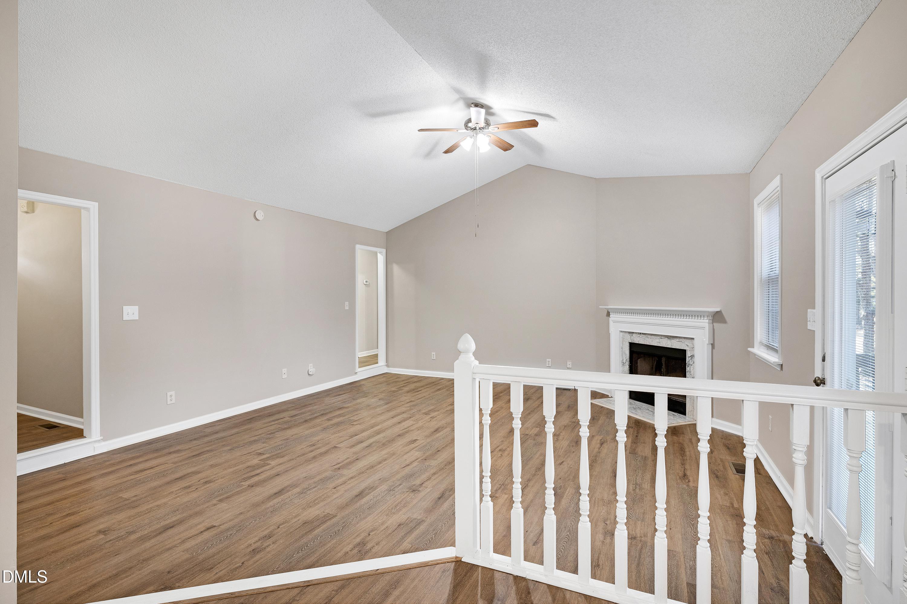 4100 Rockside Hills Drive Raleigh, NC 27603 - Photo 12 of 52 a view of a livingroom with wooden floor