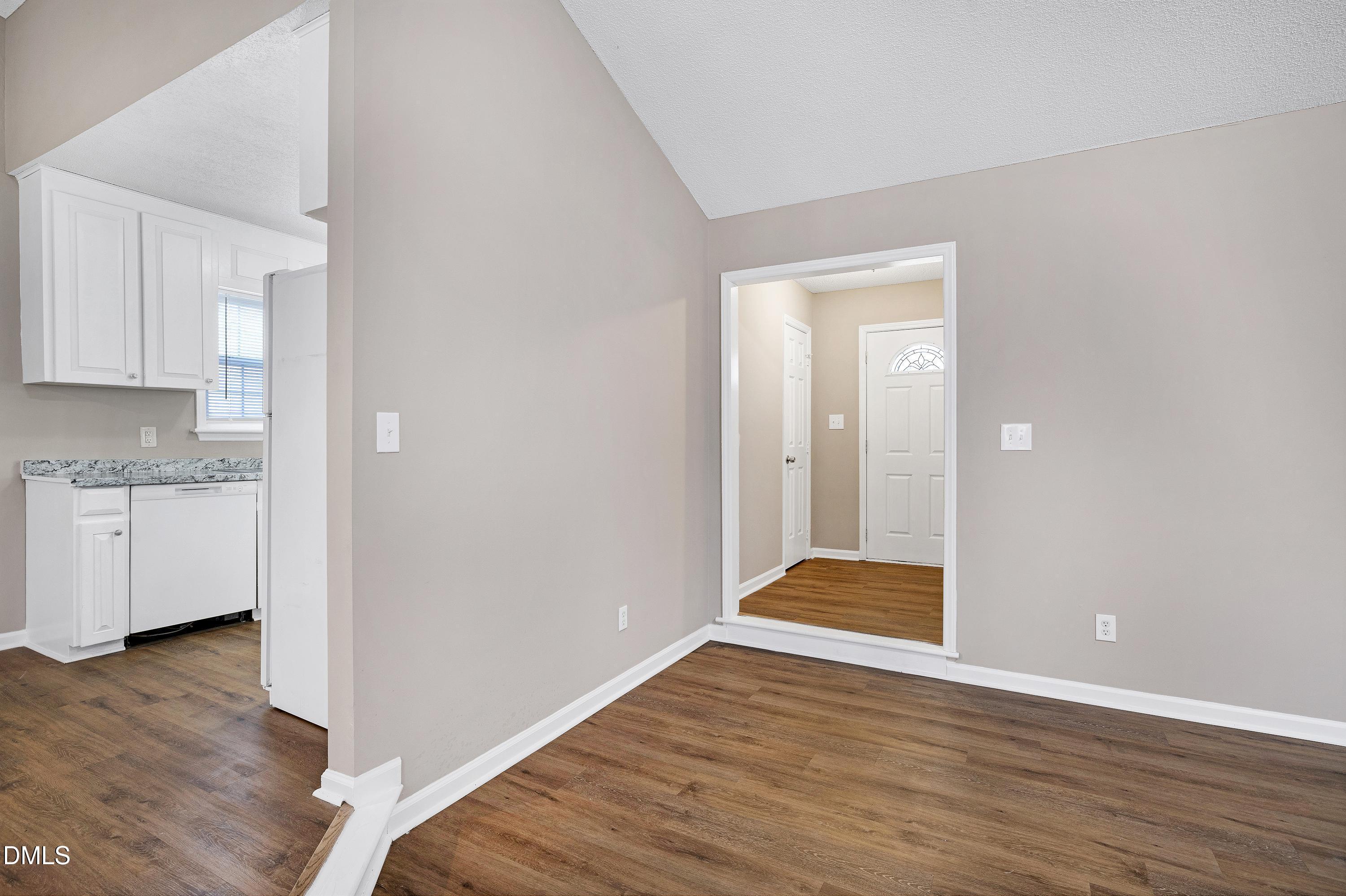 4100 Rockside Hills Drive Raleigh, NC 27603 - Photo 18 of 52 a view of an empty room and wooden floor