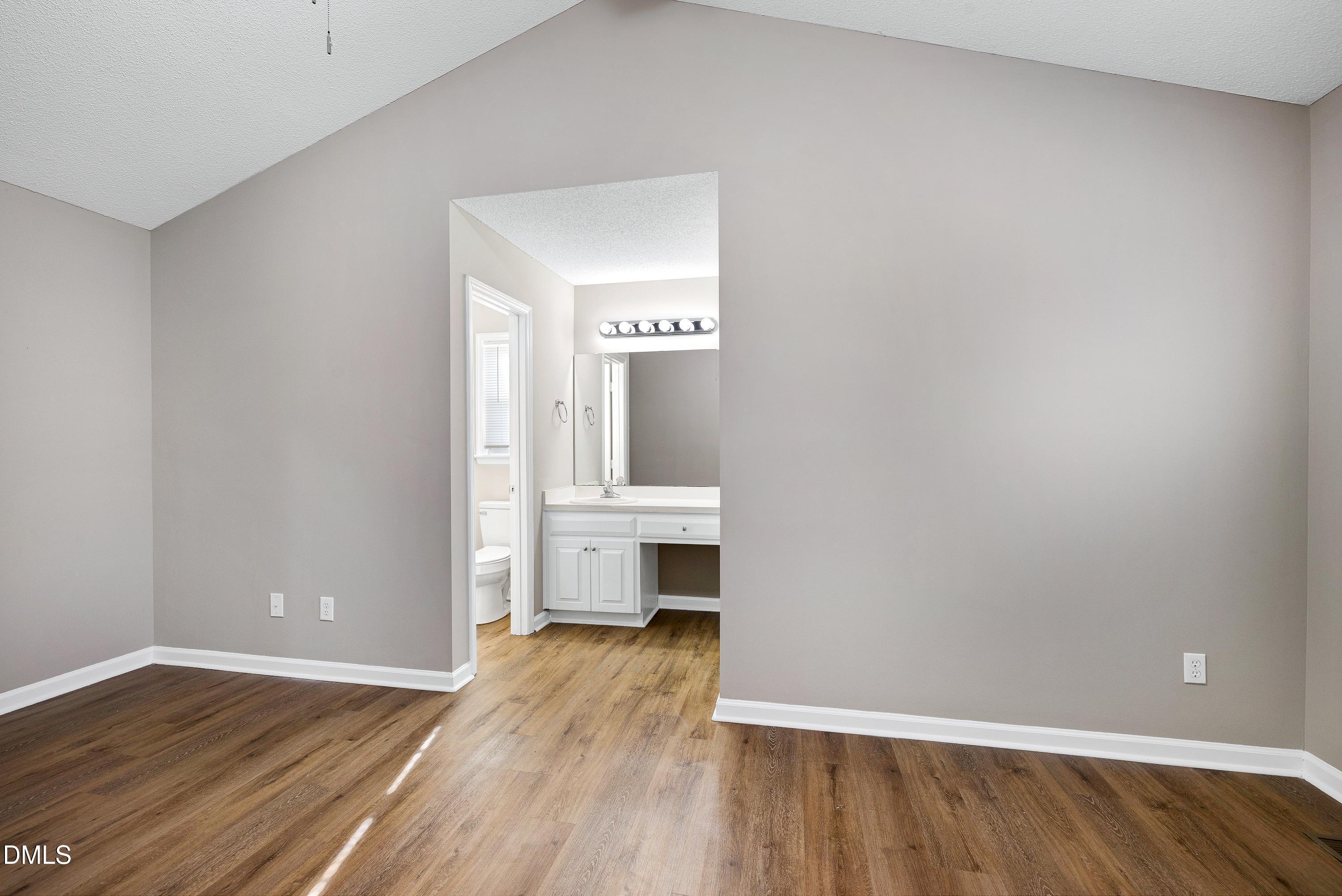 4100 Rockside Hills Drive Raleigh, NC 27603 - Photo 19 of 52 a view of a room with wooden floor and window