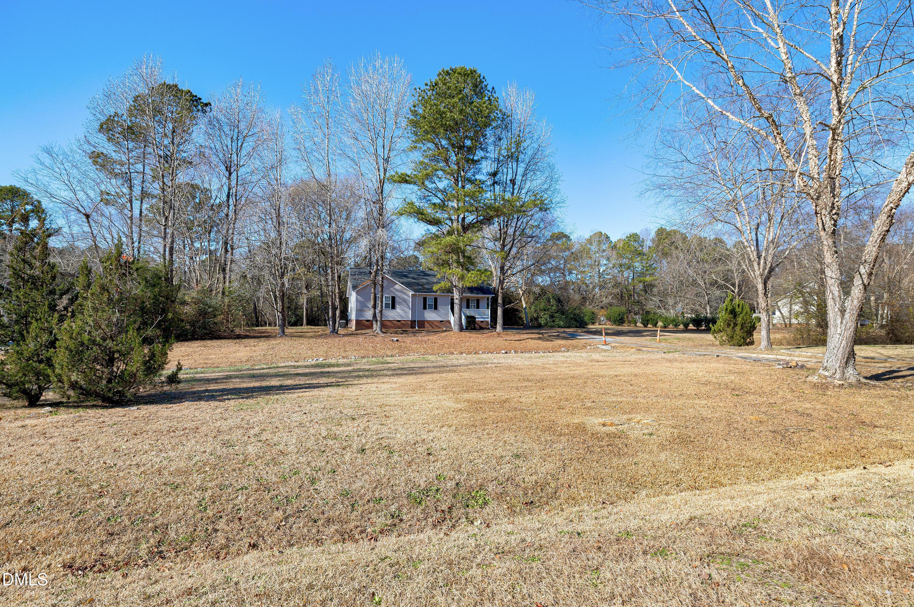 4100 Rockside Hills Drive Raleigh, NC 27603 - Photo 2 of 52 a view of outdoor space with trees all around