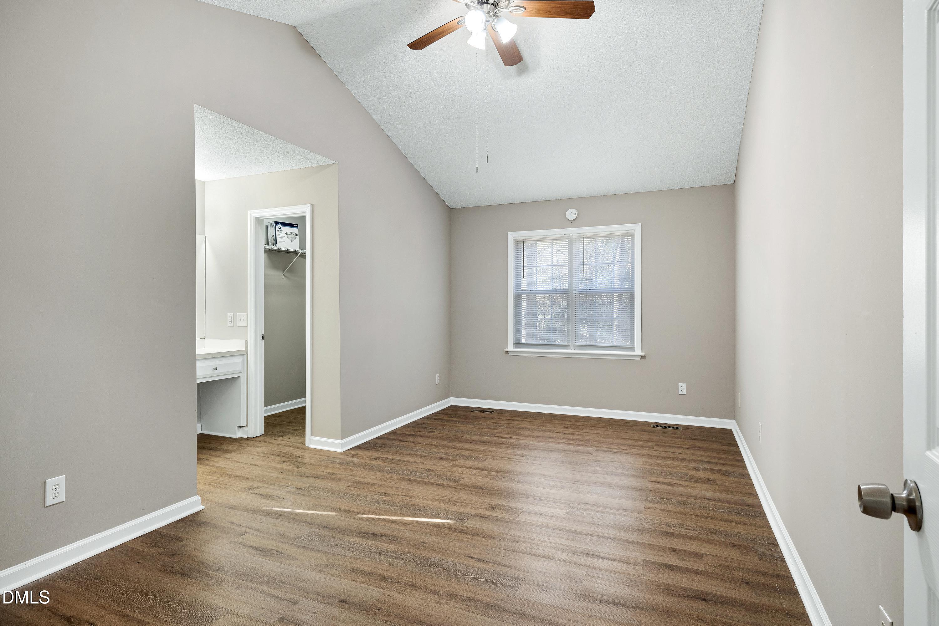 4100 Rockside Hills Drive Raleigh, NC 27603 - Photo 22 of 52 wooden floor in an empty room with a window