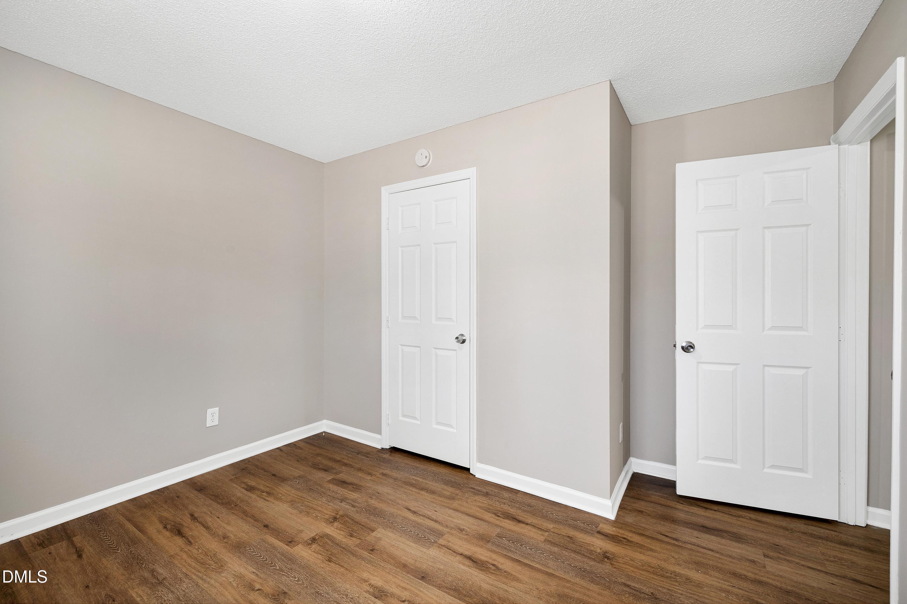 4100 Rockside Hills Drive Raleigh, NC 27603 - Photo 27 of 52 a view of an empty room with wooden floor