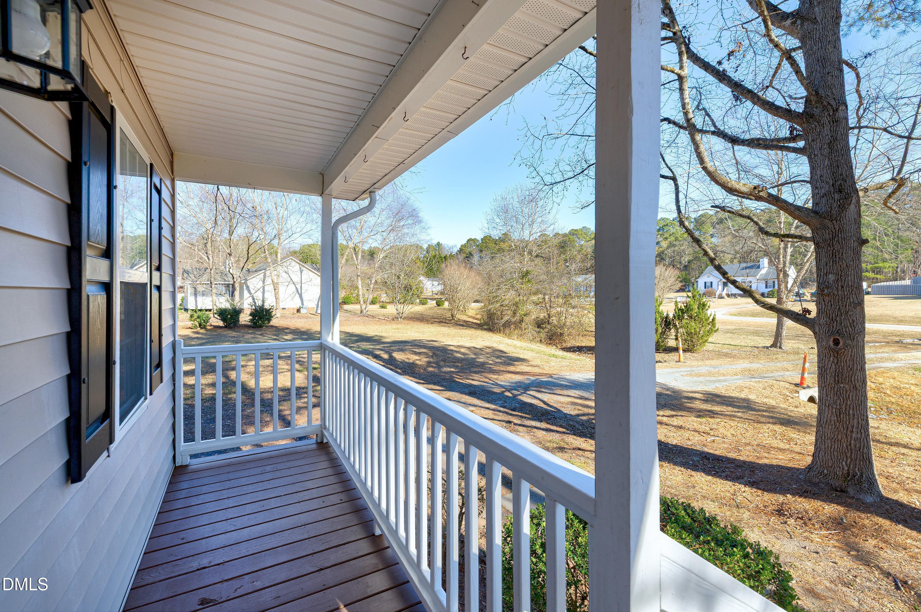 4100 Rockside Hills Drive Raleigh, NC 27603 - Photo 30 of 52 a view of a balcony with wooden floor