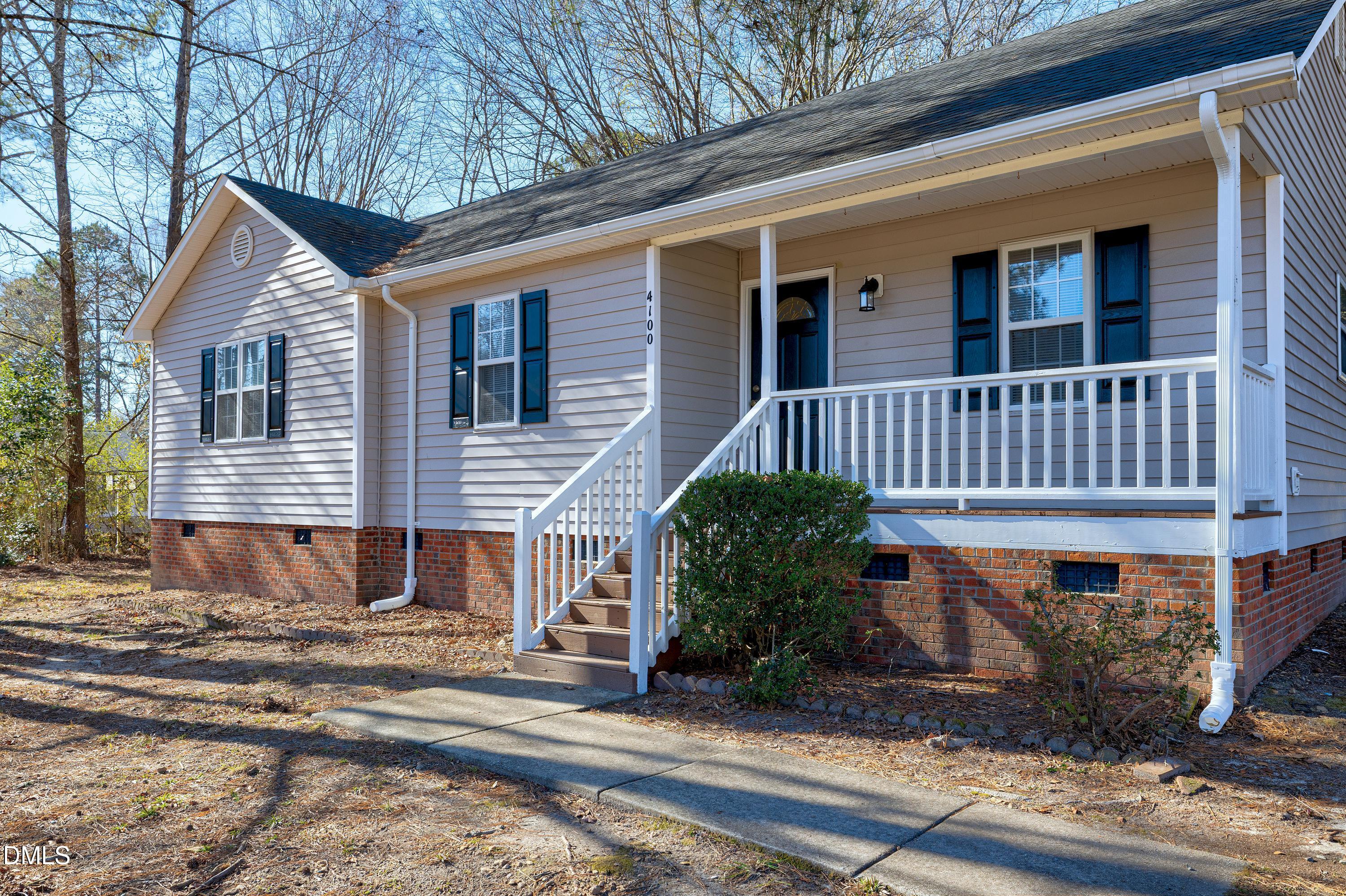 4100 Rockside Hills Drive Raleigh, NC 27603 - Photo 33 of 52 a view of a house with a yard and sitting area