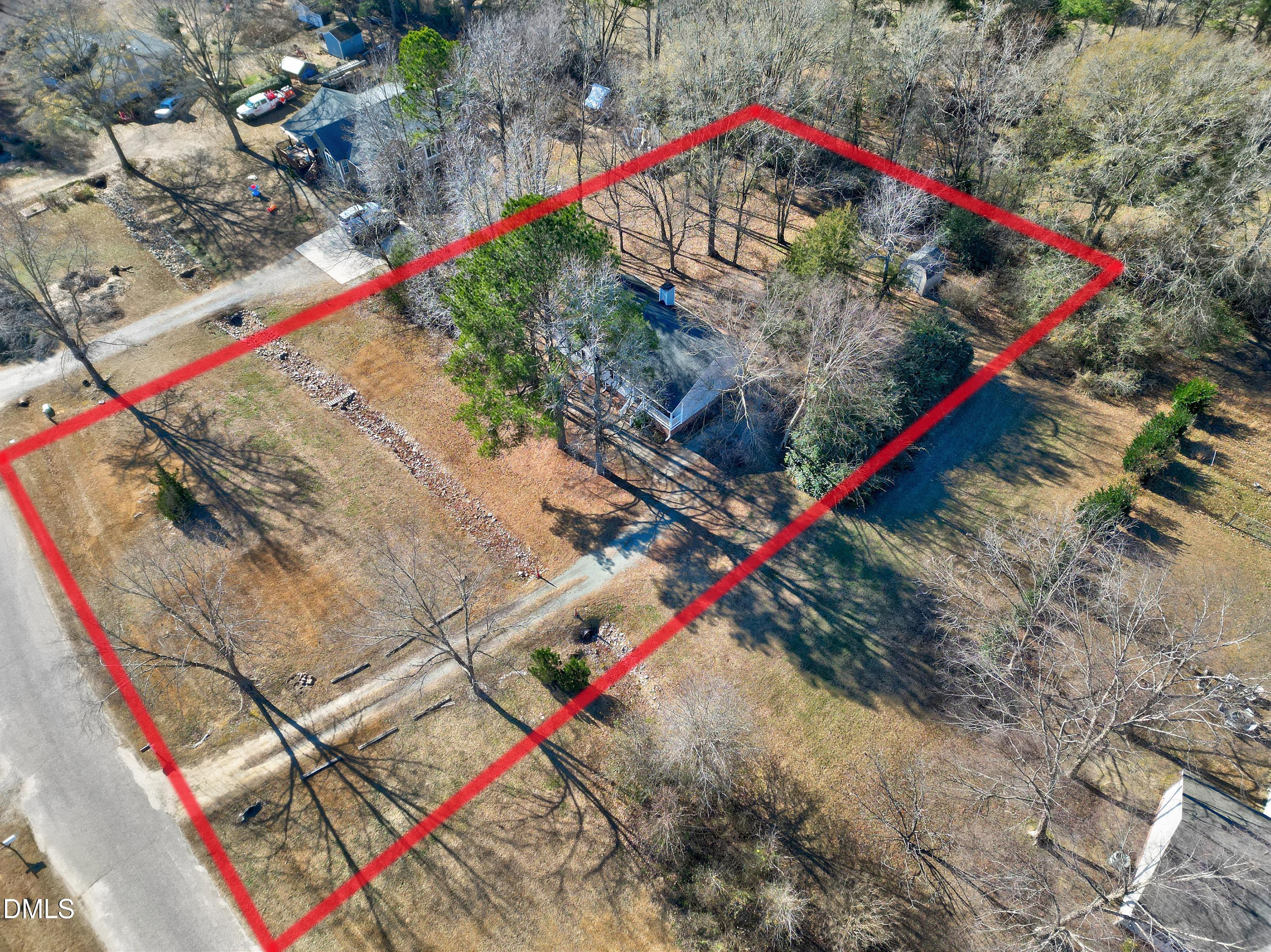 4100 Rockside Hills Drive Raleigh, NC 27603 - Photo 37 of 52 a view of a tennis ground with a large tree