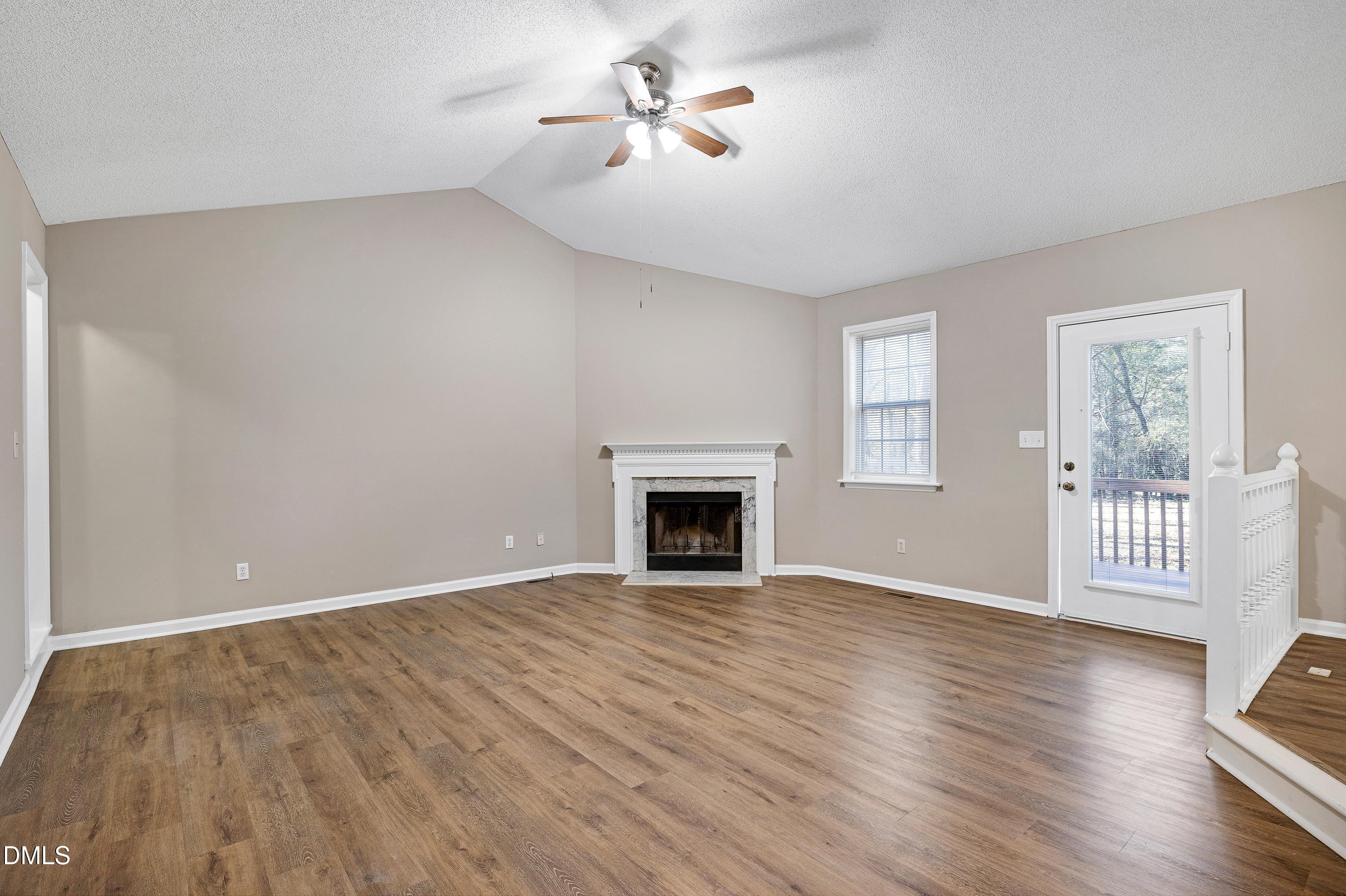 4100 Rockside Hills Drive Raleigh, NC 27603 - Photo 4 of 52 a view of empty room with wooden floor and fan
