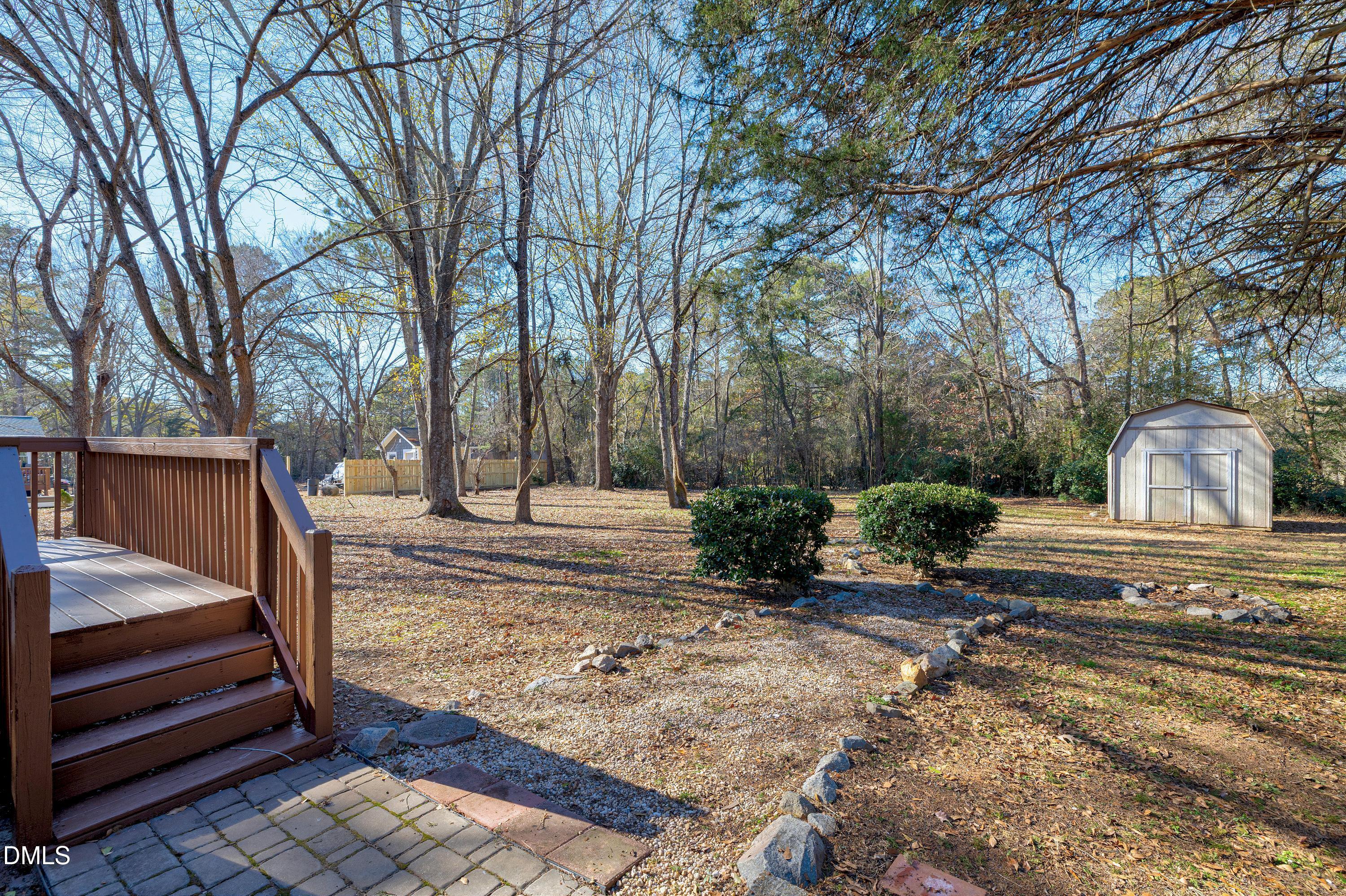 4100 Rockside Hills Drive Raleigh, NC 27603 - Photo 41 of 52 a view of a yard with large trees
