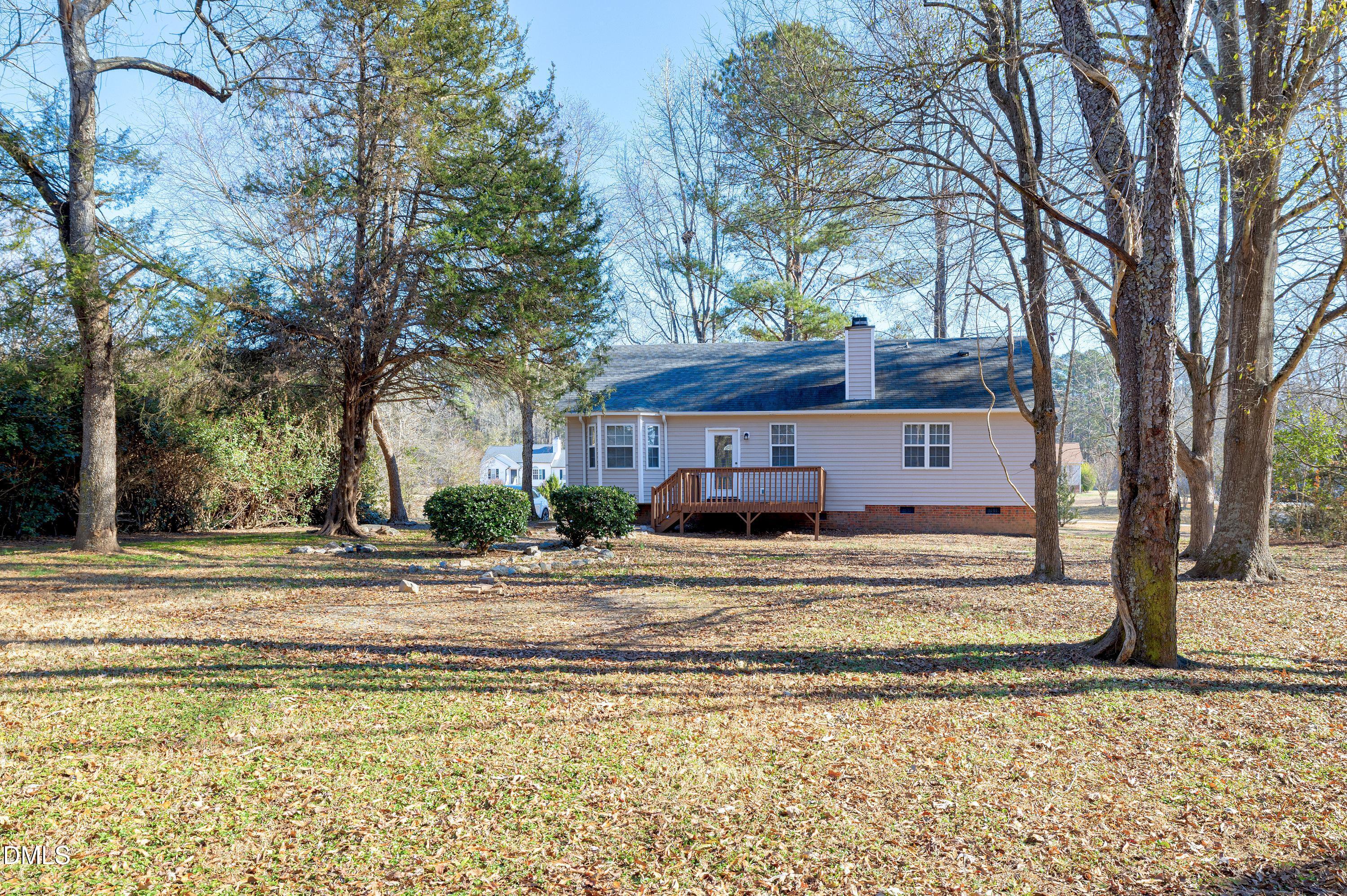 4100 Rockside Hills Drive Raleigh, NC 27603 - Photo 45 of 52 a view of a house with a yard