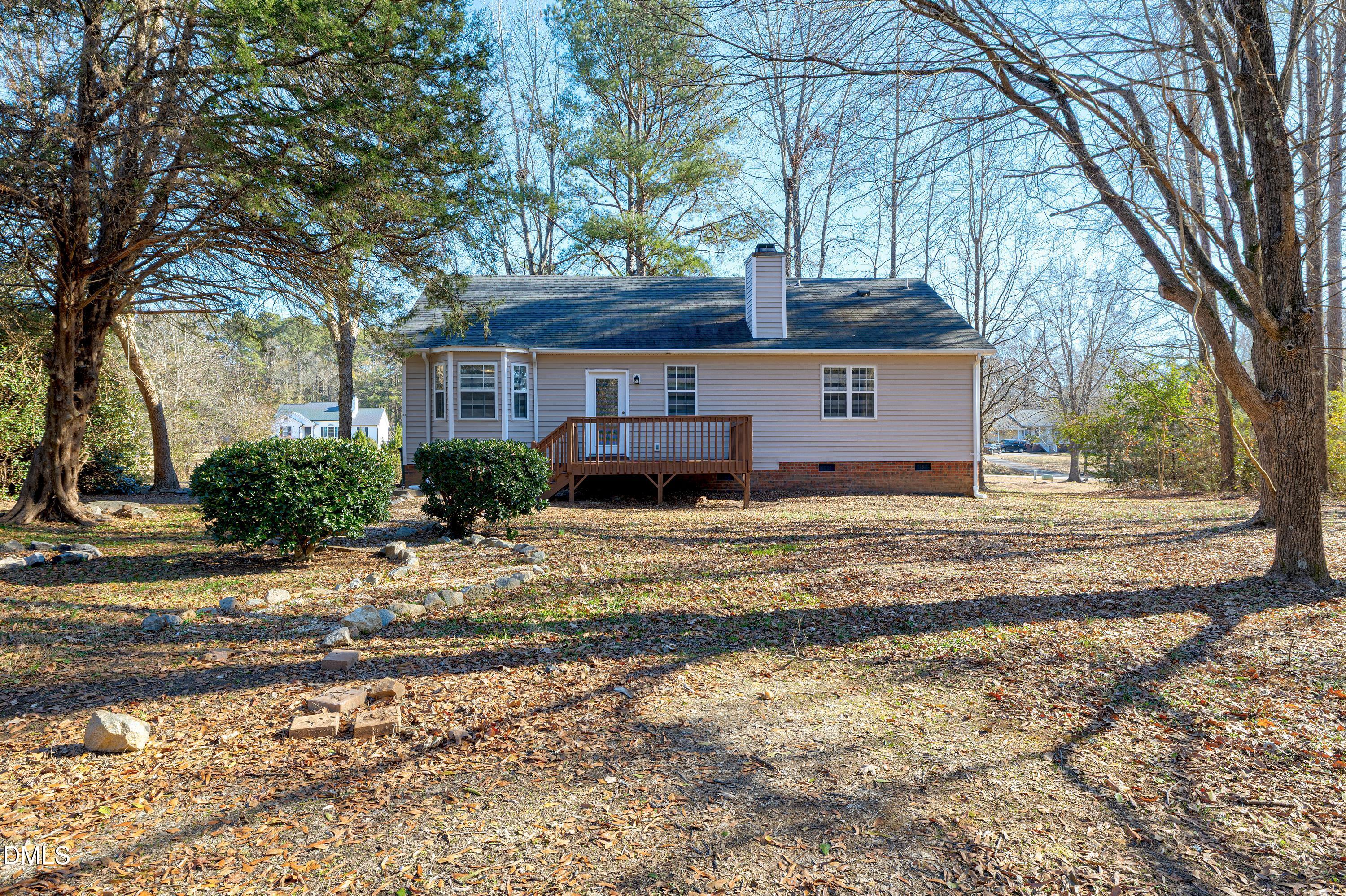 4100 Rockside Hills Drive Raleigh, NC 27603 - Photo 46 of 52 a view of a house with a yard covered in snow