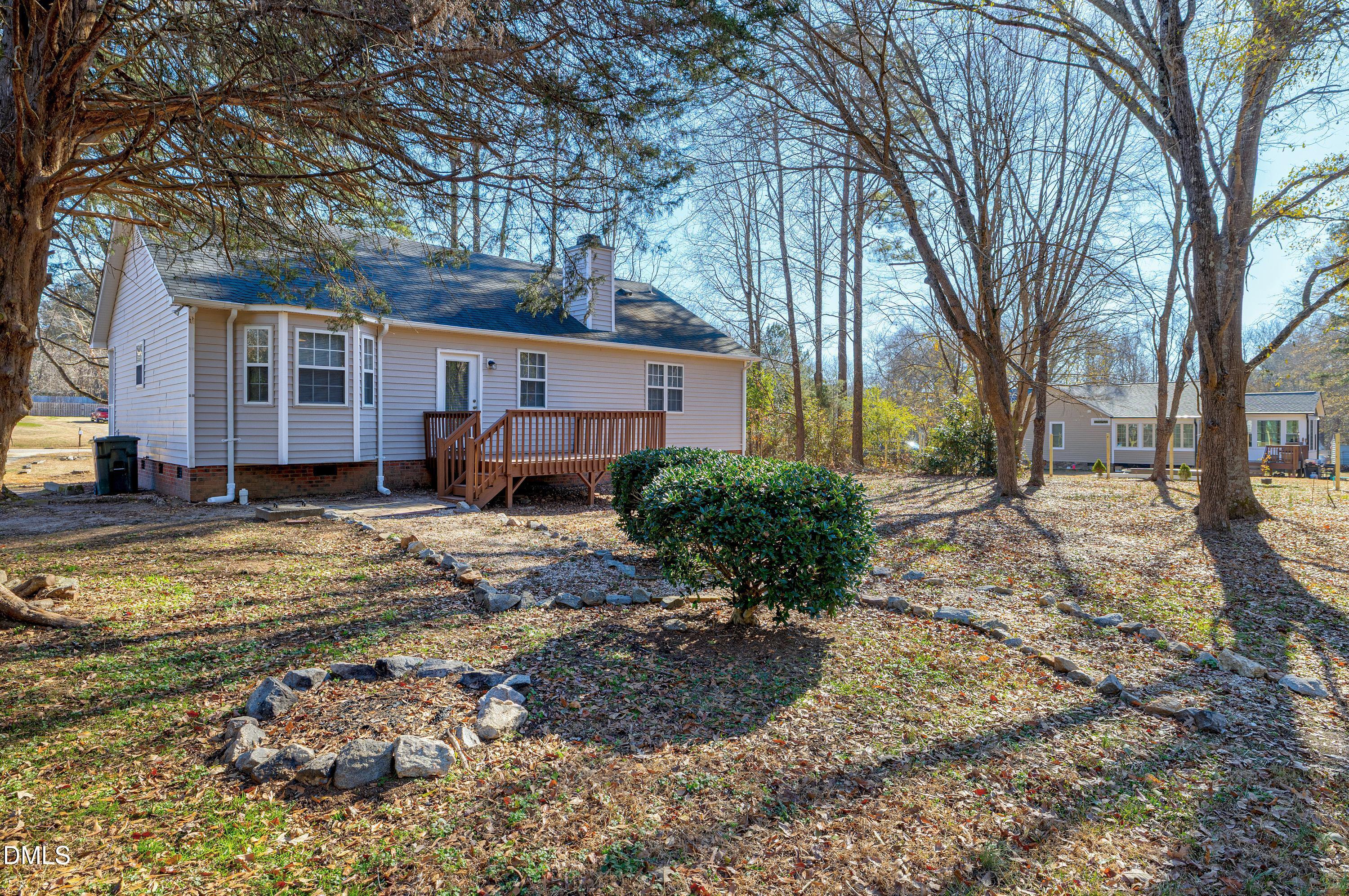 4100 Rockside Hills Drive Raleigh, NC 27603 - Photo 47 of 52 a view of a house with a yard covered in snow