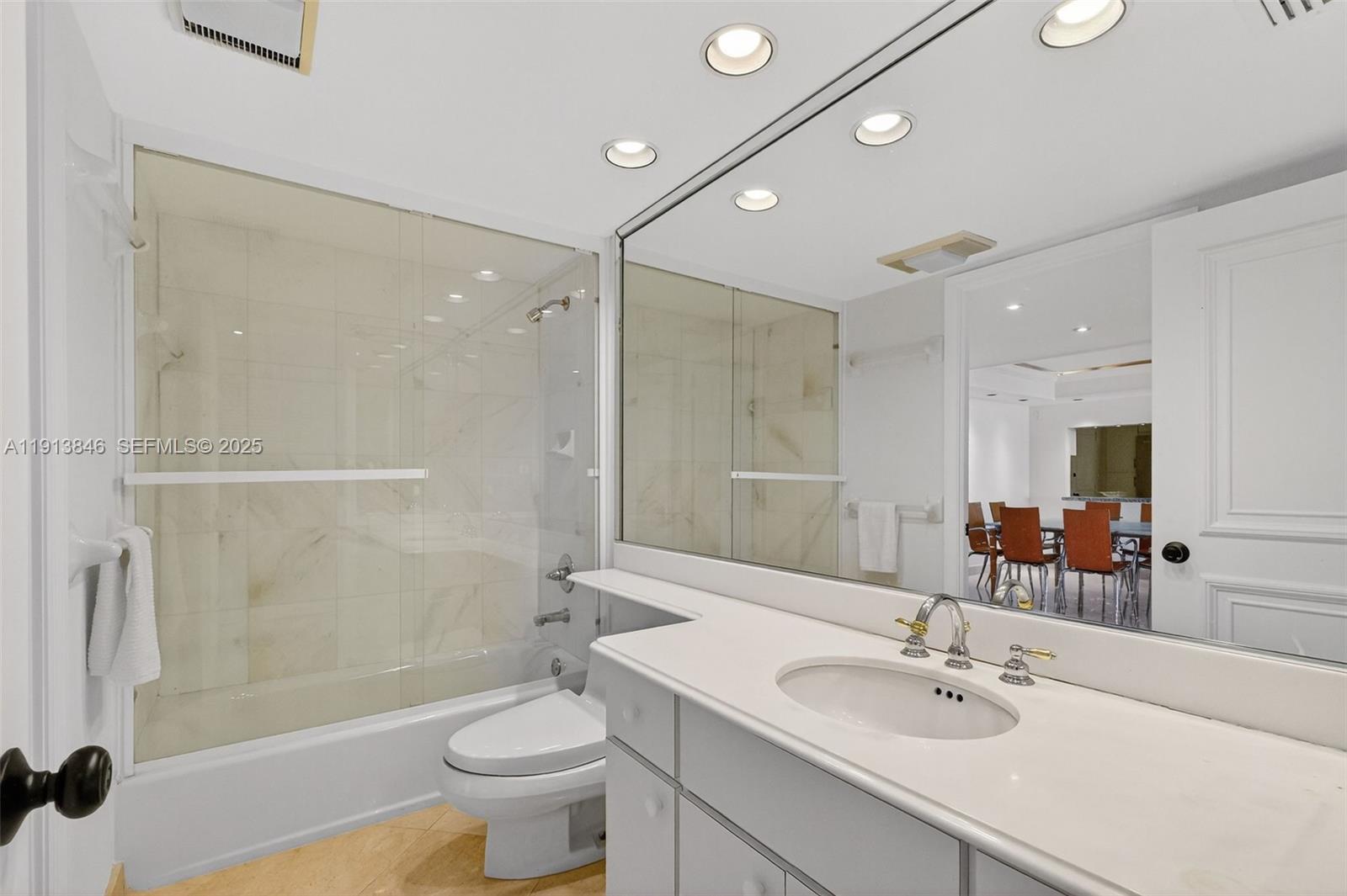 2 Grove Isle Drive, Unit B1505 Miami, FL 33133 - Photo 15 of 51 a bathroom with a sink a toilet and shower