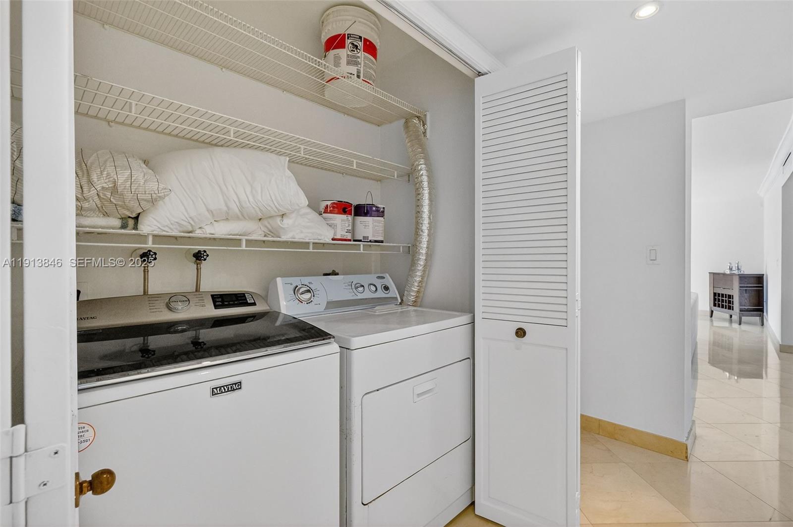2 Grove Isle Drive, Unit B1505 Miami, FL 33133 - Photo 37 of 51 a utility room with sink dryer and washer