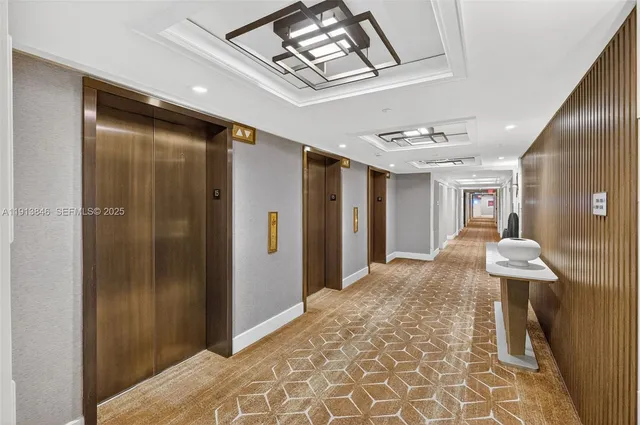 a building outdoor space with patio furniture and potted plants