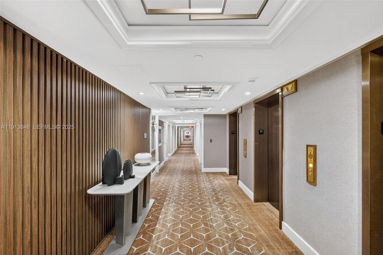 2 Grove Isle Drive, Unit B1505 Miami, FL 33133 - Photo 39 of 51 a view of a hallway with furniture and window
