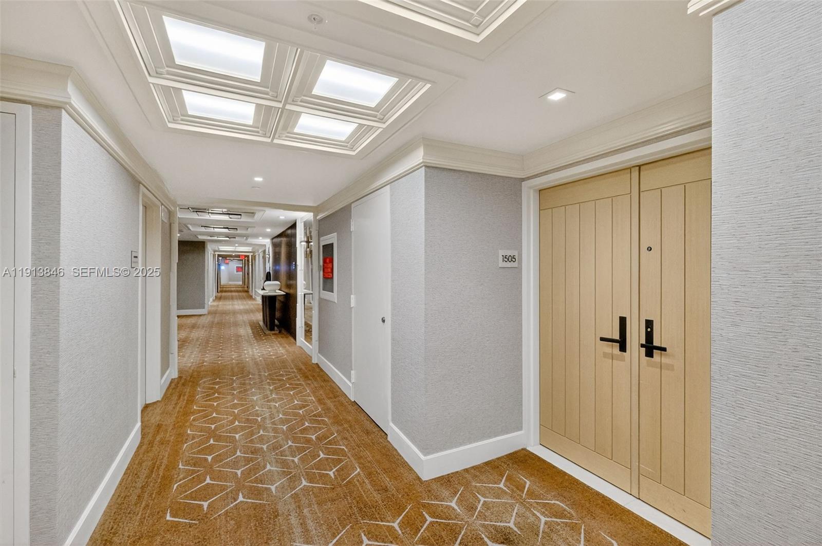 2 Grove Isle Drive, Unit B1505 Miami, FL 33133 - Photo 40 of 51 a view of a hallway with closet and wooden floor