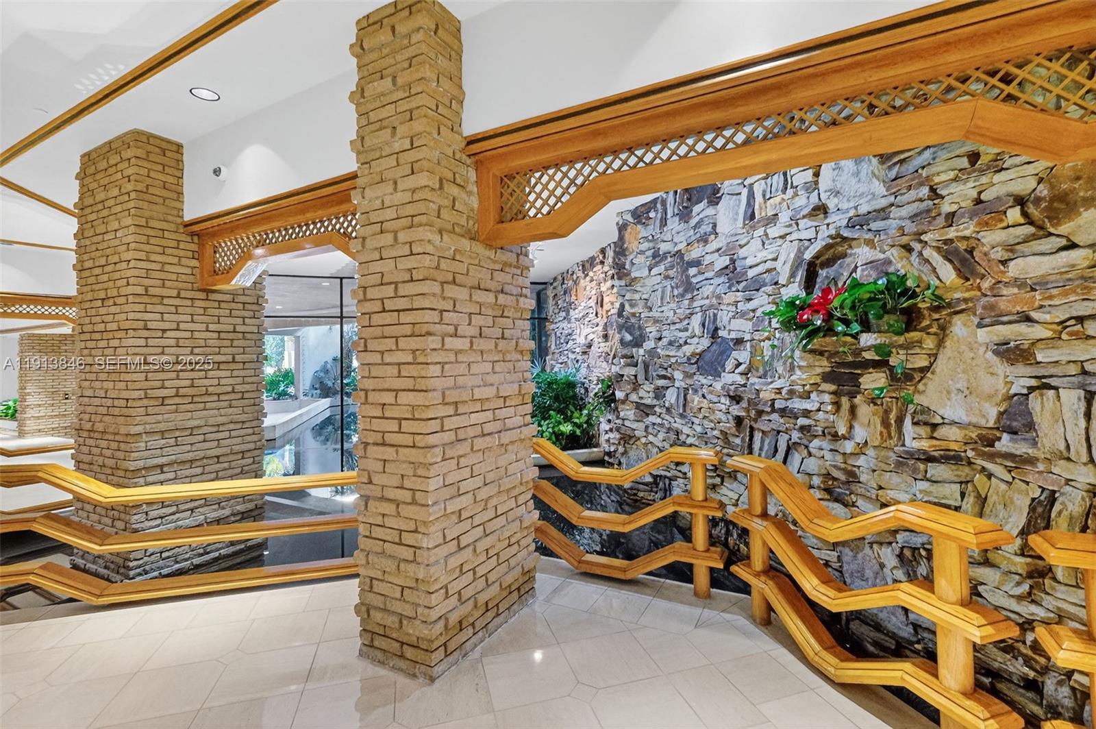 2 Grove Isle Drive, Unit B1505 Miami, FL 33133 - Photo 42 of 51 a building outdoor space with patio furniture and potted plants