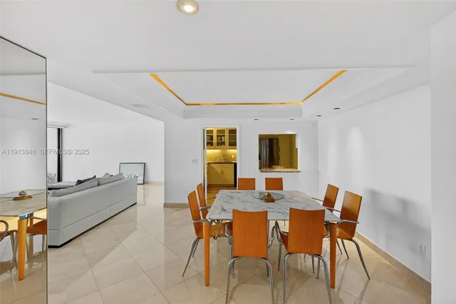 a view of a dining room with furniture and window