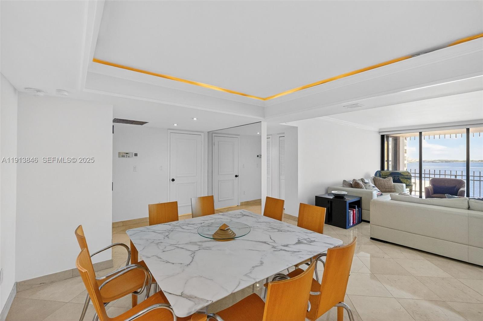 2 Grove Isle Drive, Unit B1505 Miami, FL 33133 - Photo 8 of 51 a view of a dining room with furniture