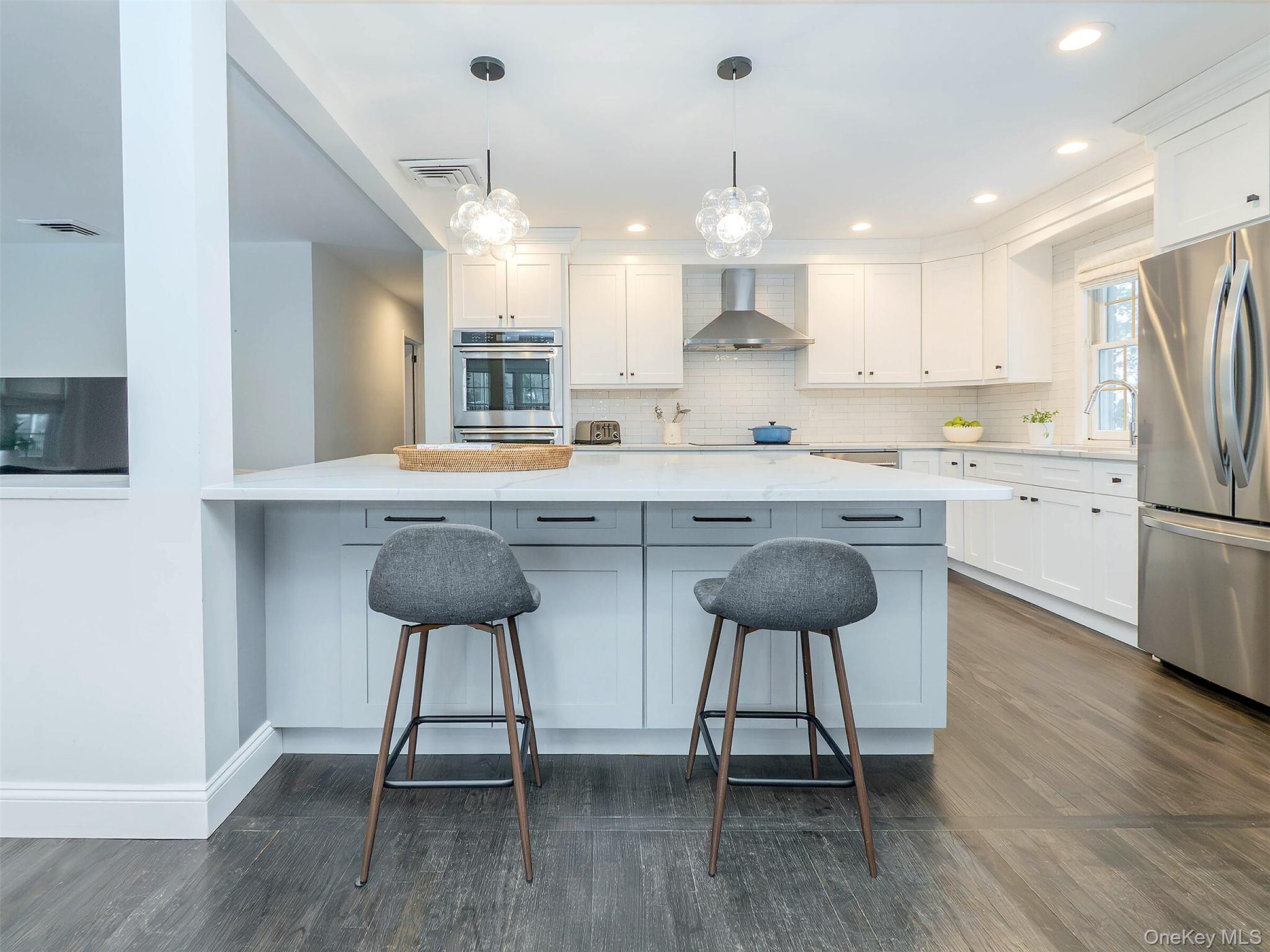 16 Underhill Road Glen Head, NY 11545 - Photo 2 of 30 Open kitchen, stool seating at the island. Under counter storage.