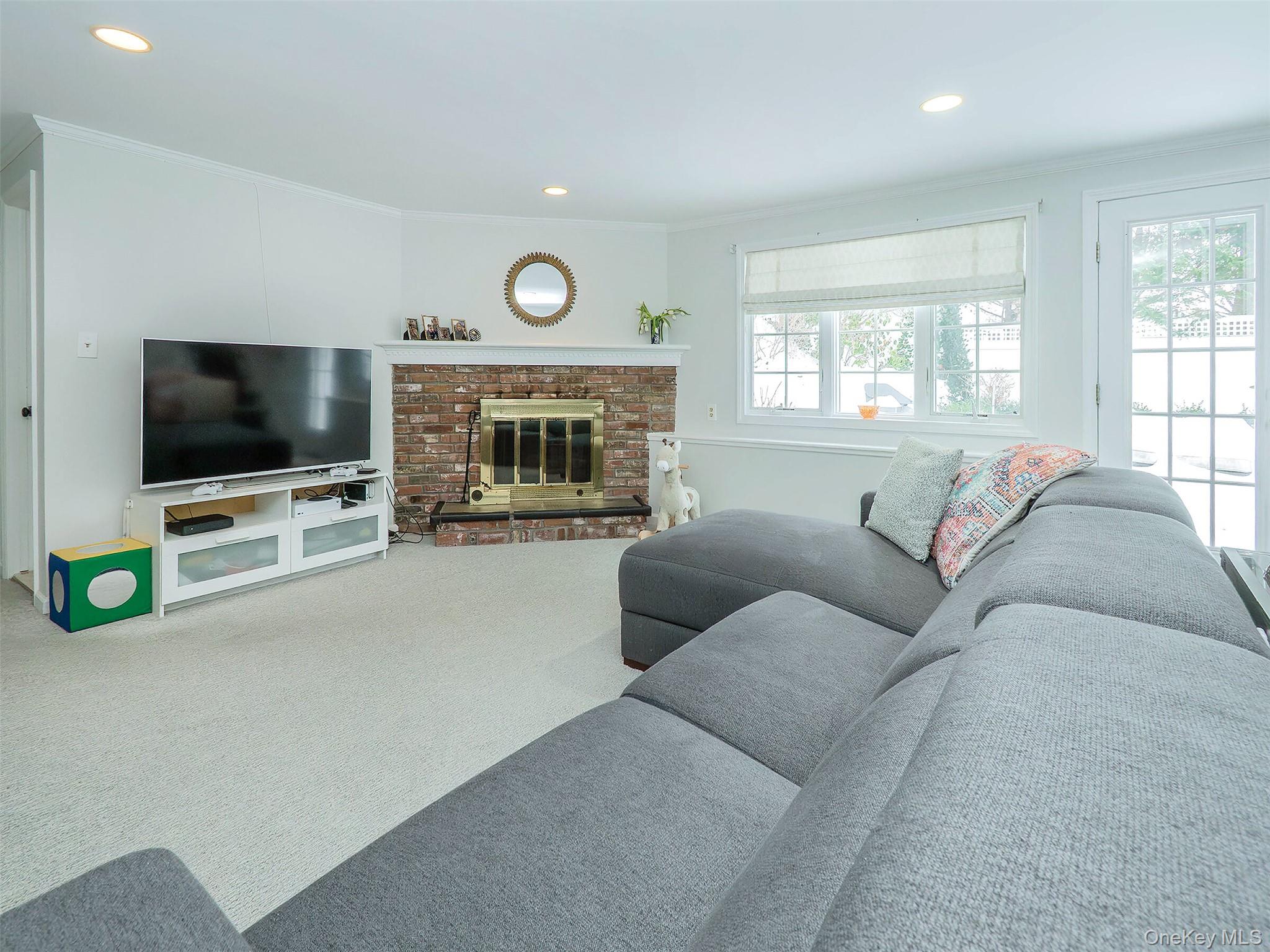 16 Underhill Road Glen Head, NY 11545 - Photo 23 of 30 Great light coming into the den. Door out to the side patio.