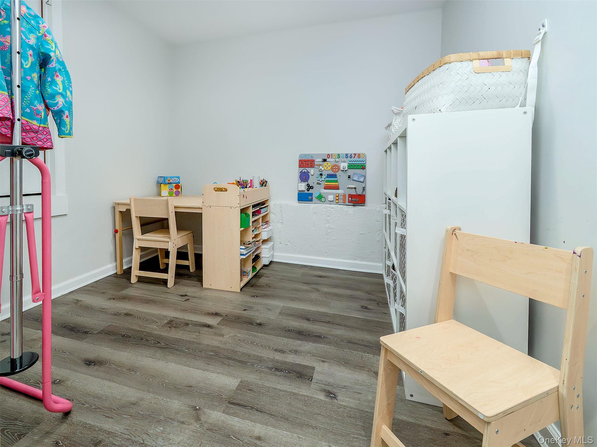 16 Underhill Road Glen Head, NY 11545 - Photo 28 of 30 Lower Level: Hallway/Hobby area. Door to garage and the LARGE storage space.