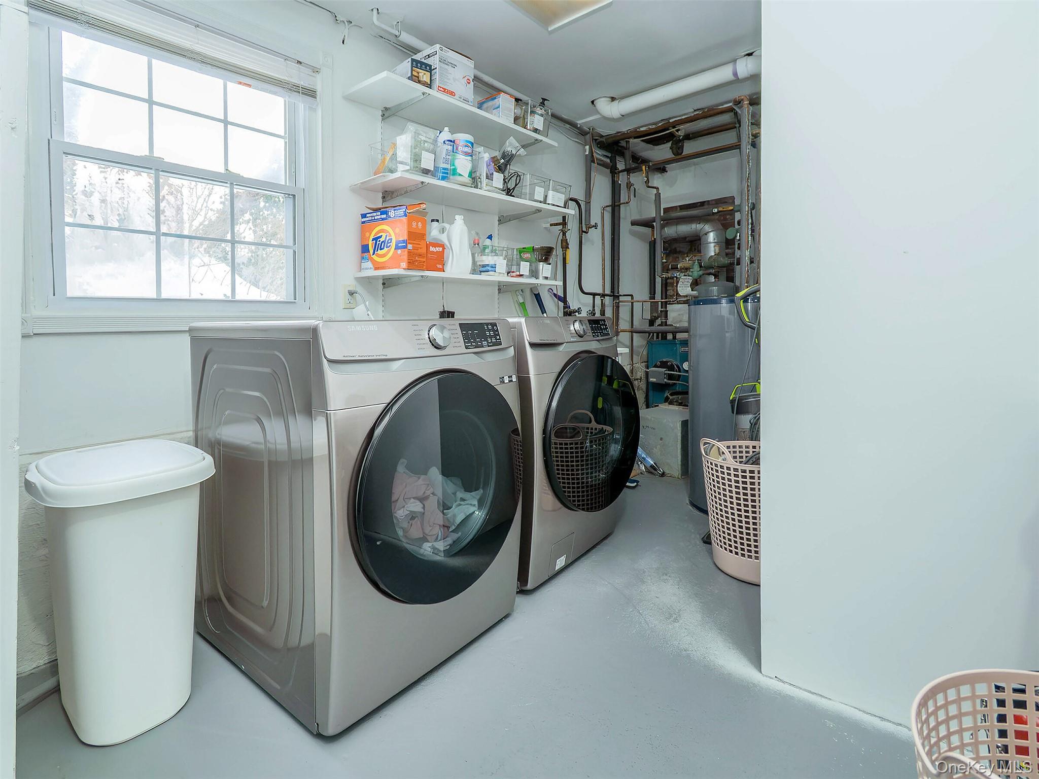 16 Underhill Road Glen Head, NY 11545 - Photo 30 of 30 Lower Level: Laundry room with free standing oil tank, mechanicals & extra fridge.