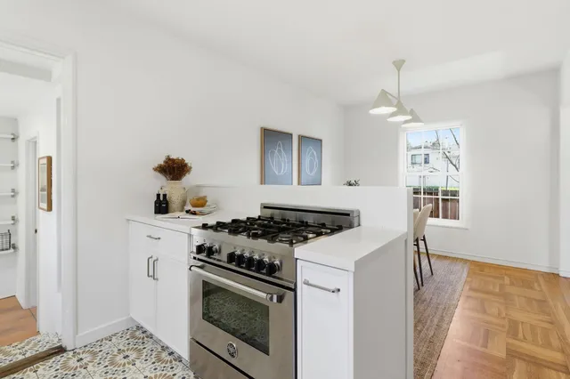 a kitchen with a sink stove and refrigerator