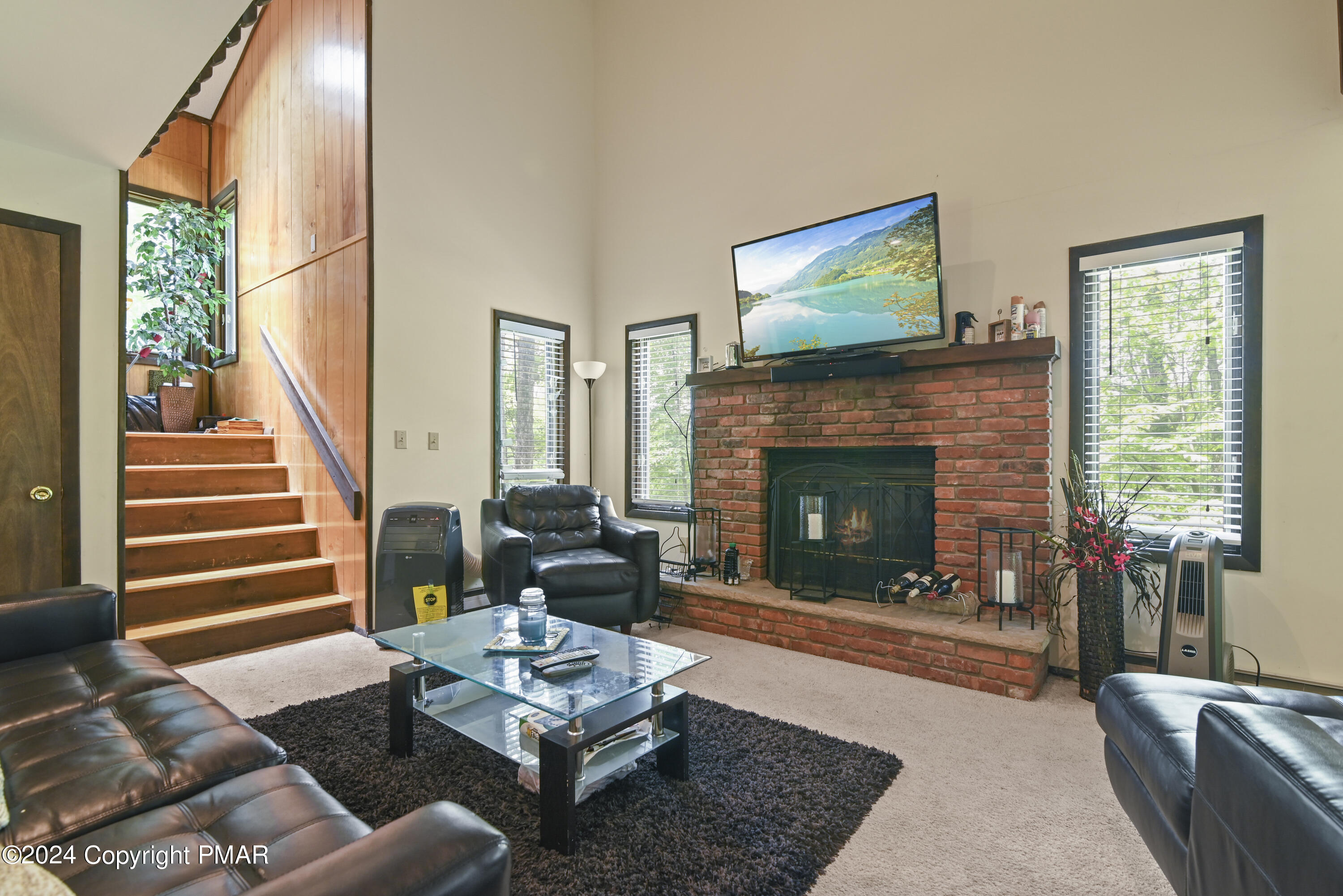 115 Salisbury Road Bushkill, PA 18324 - Photo 15 of 32 a living room with furniture fireplace and window