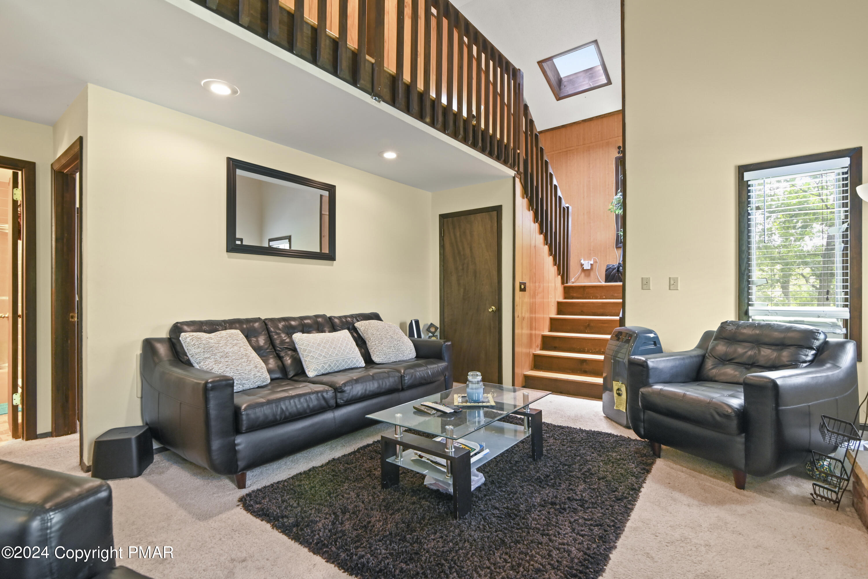 115 Salisbury Road Bushkill, PA 18324 - Photo 16 of 32 a living room with furniture and a potted plant
