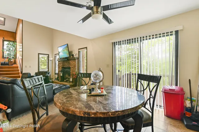 a view of a dining room with furniture window and outside view