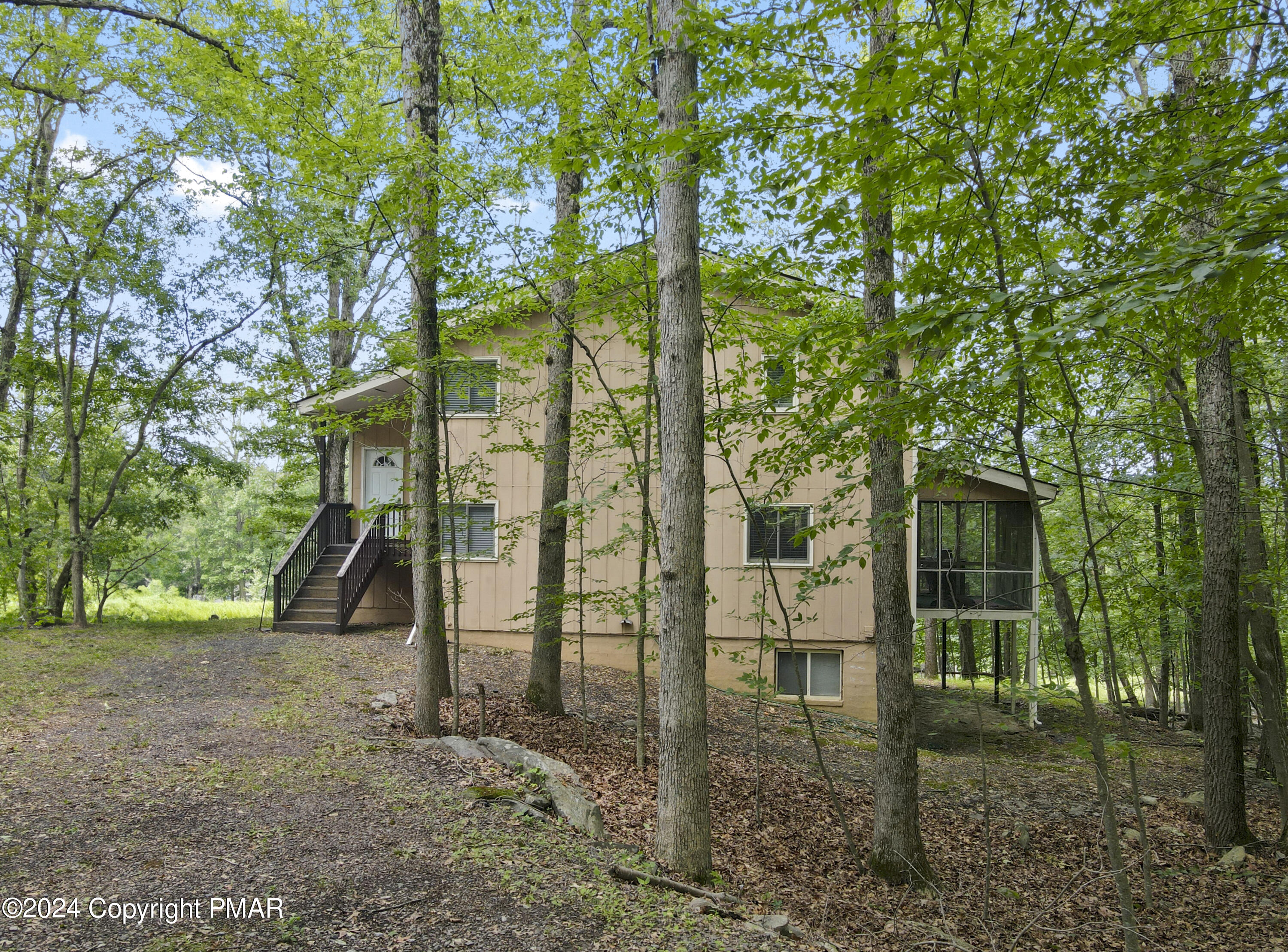 115 Salisbury Road Bushkill, PA 18324 - Photo 2 of 32 a view of a brick house with large trees