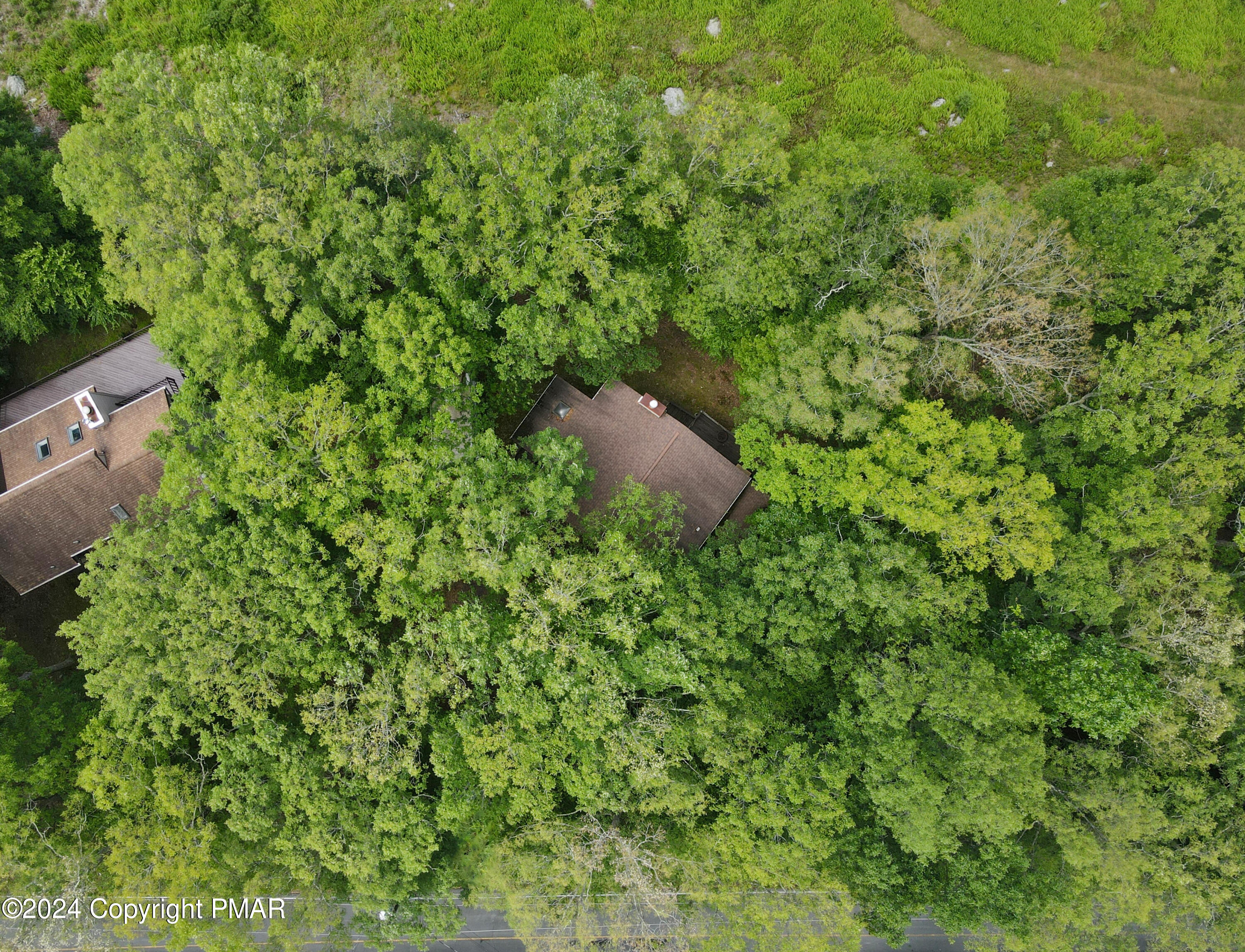 115 Salisbury Road Bushkill, PA 18324 - Photo 31 of 32 a backyard of a house with lots of green space and a fountain