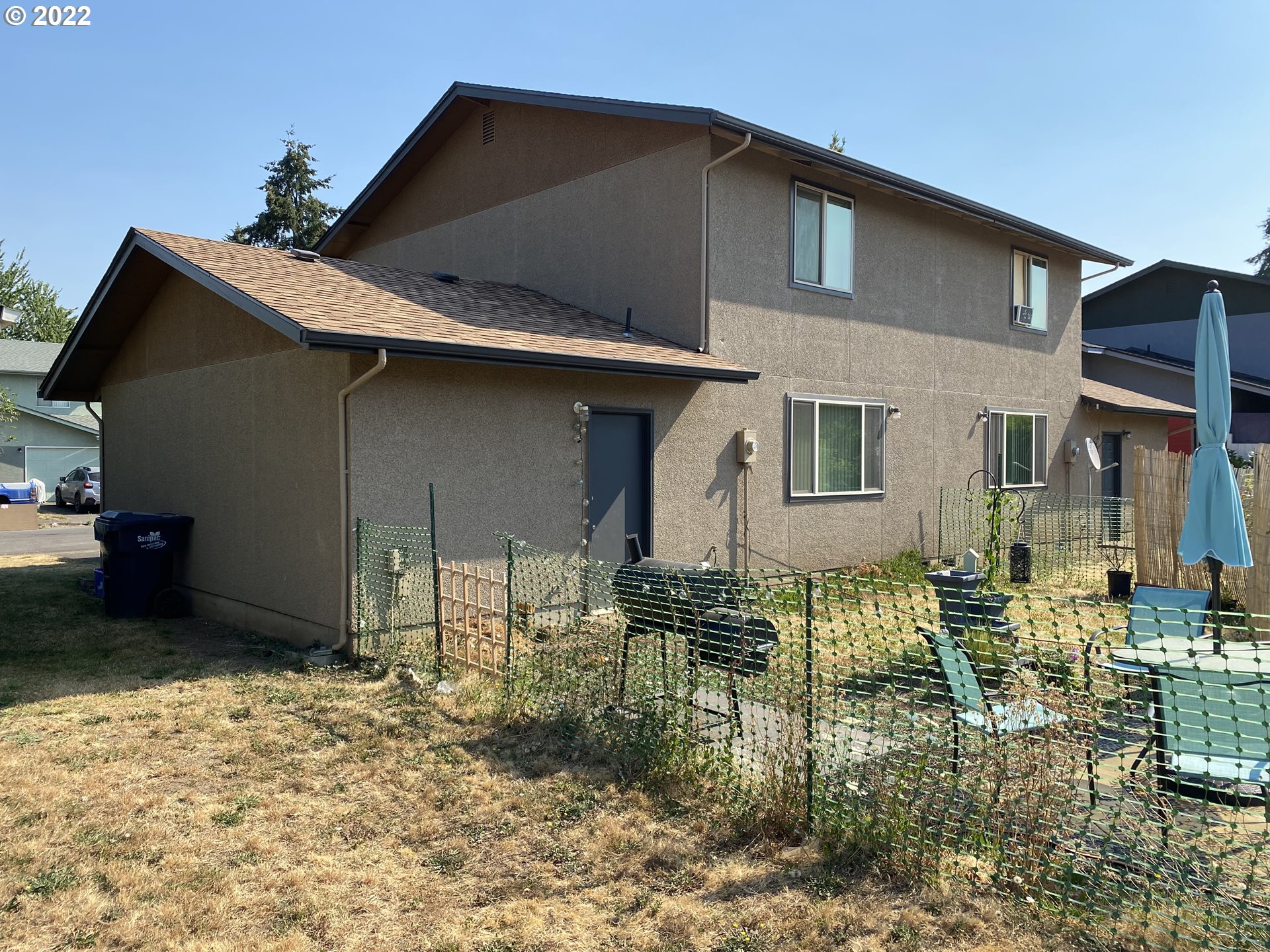 85 V Street Springfield, OR 97477 - Photo 24 of 25 a backyard of a house with yard and outdoor seating