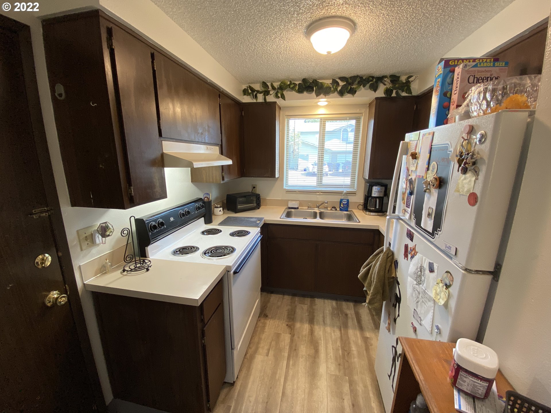85 V Street Springfield, OR 97477 - Photo 6 of 25 a view of a kitchen with a sink a washer and dryer