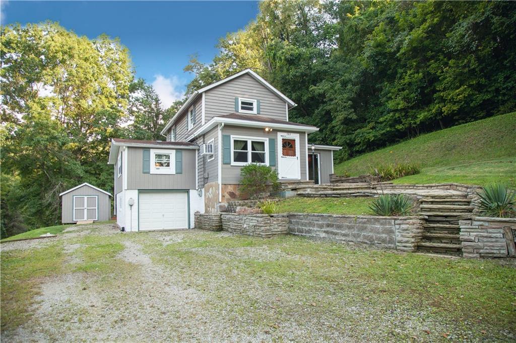 583 River Road Perryopolis, PA 15473 - Photo 22 of 23 a front view of a house with a yard