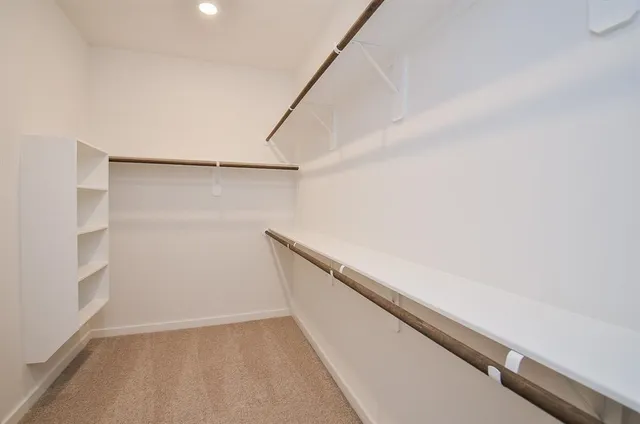 a view of an empty walk in closet
