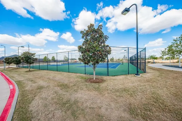 a view of a park with swings and slides