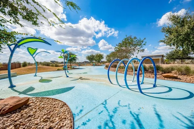 a view of yard with wooden fence