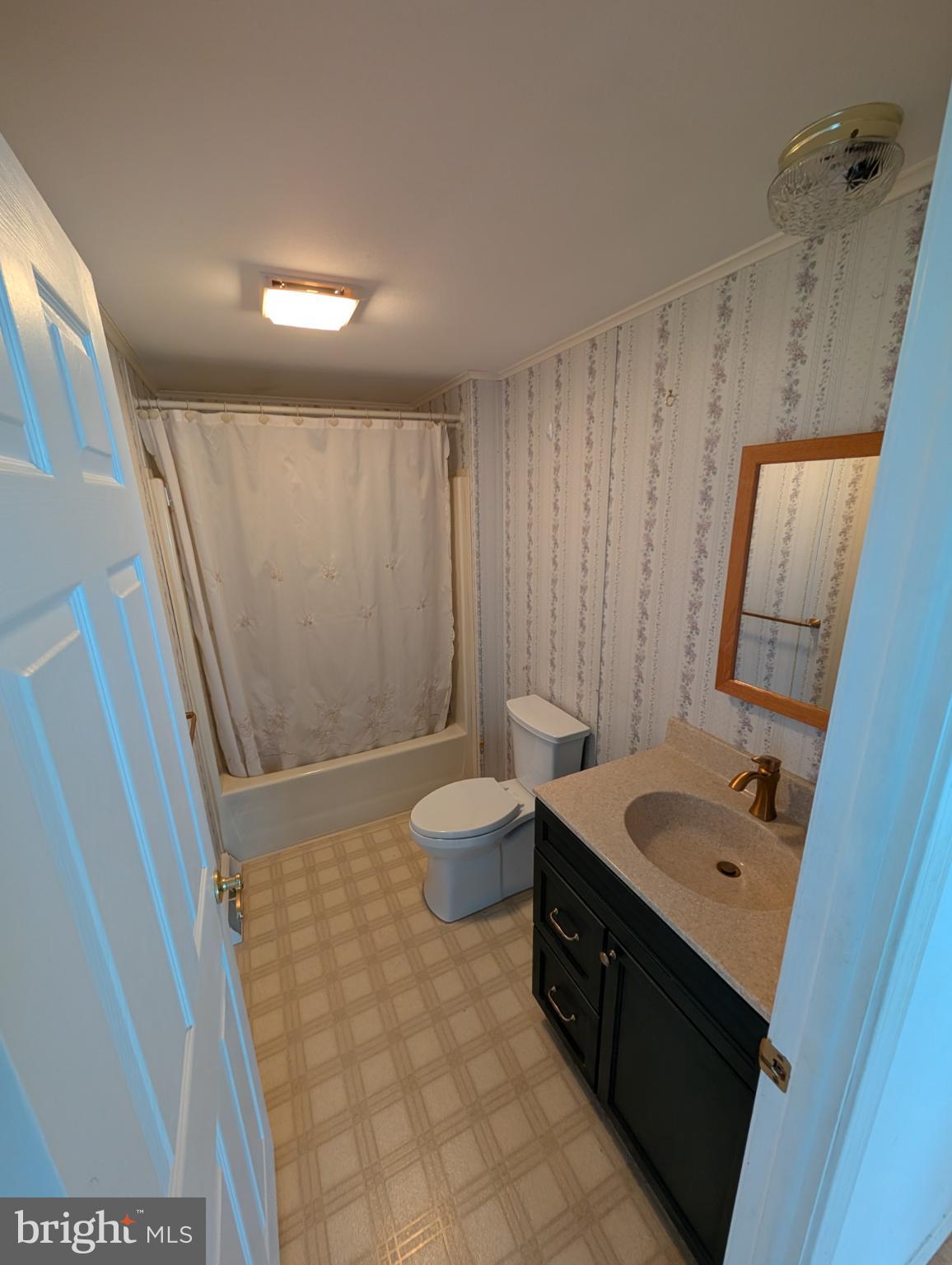 161 Grouse Circle New Hope, PA 18938 - Photo 13 of 16 a bathroom with a sink a toilet a mirror and shower
